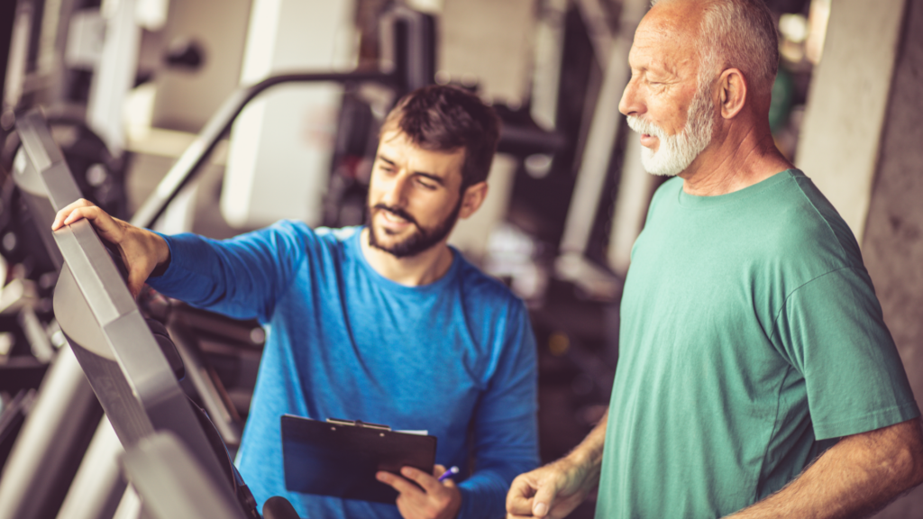Older white male exercises on treadmill to get rid of headaches with PT supervision